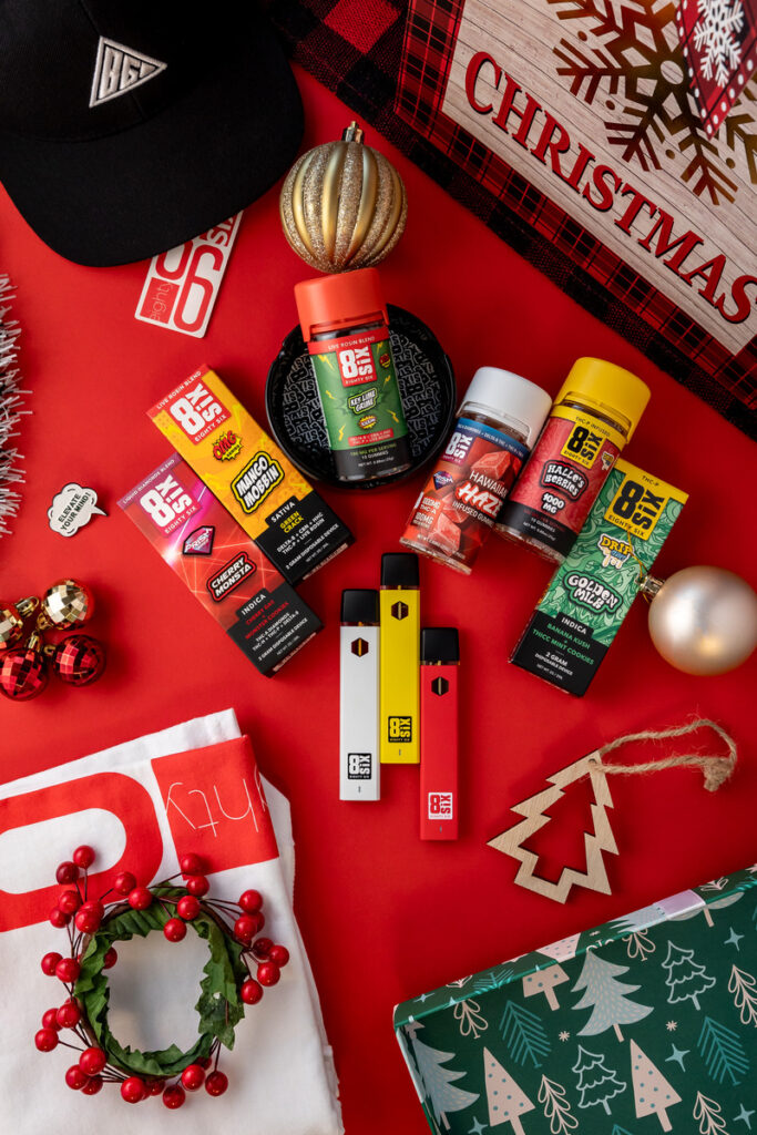 A variety of Eighty Six products on a table with Christmas decorations
